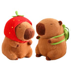Capivara de Pelúcia com Capuz de Morango e Mochila de Tartaruga Capivara de Pelúcia com Capuz de Morango e Mochila de Tartaruga Loja do Bambino Combo 2 Unidades 25cm 